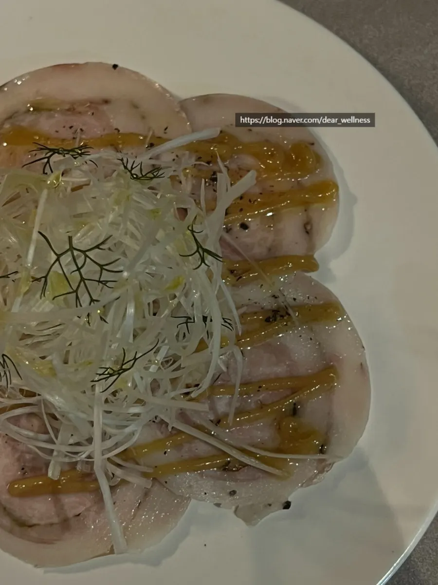 Plate of black pork carpaccio at Plot