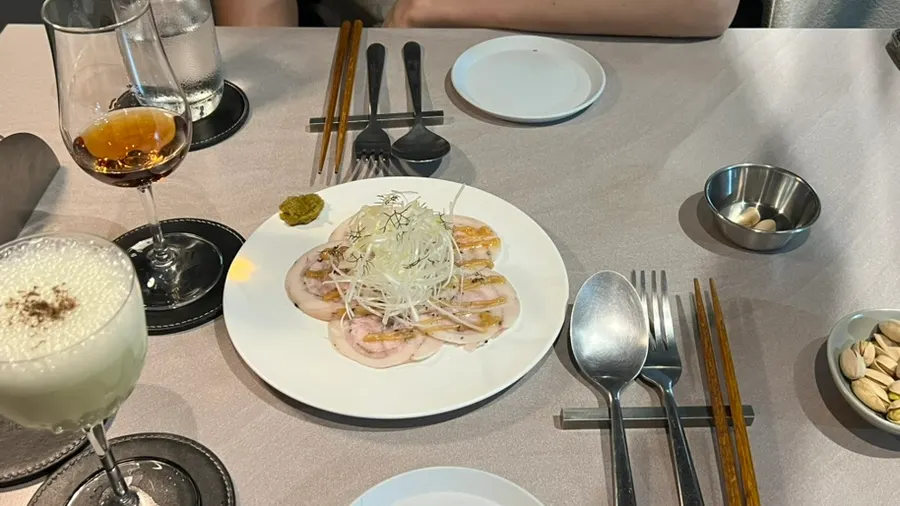 Snacks and glasses on a table at Plot