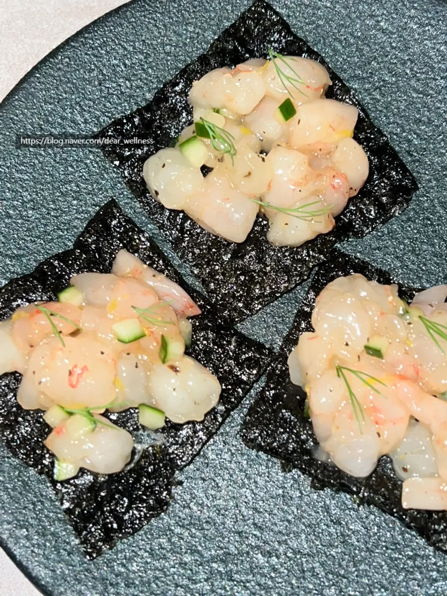 Plating of the sweet shrimp tartare at Plot