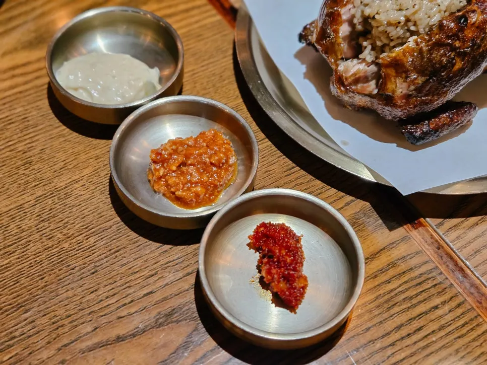 Side dishes set out alongside the wood-fired chicken