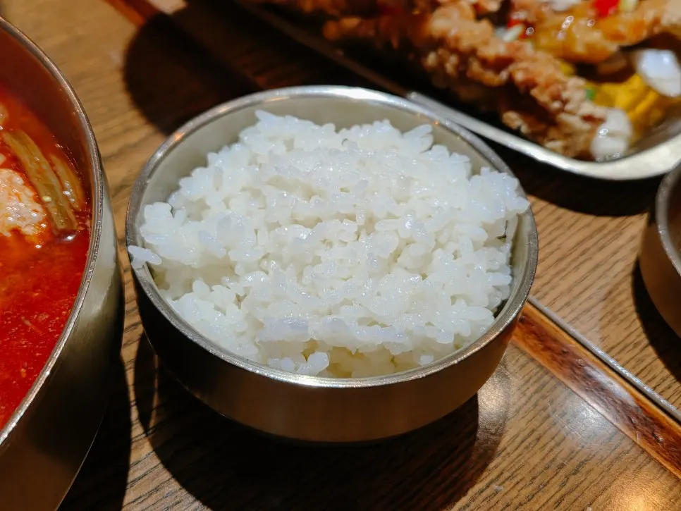 A table setting with a bowl full of dakgaejang broth