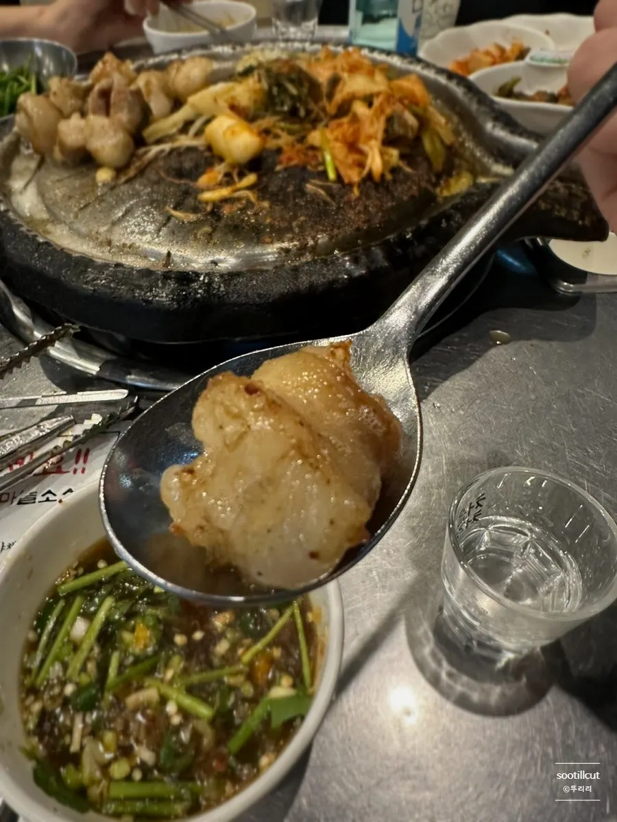 Plump daechang placed on a spoon