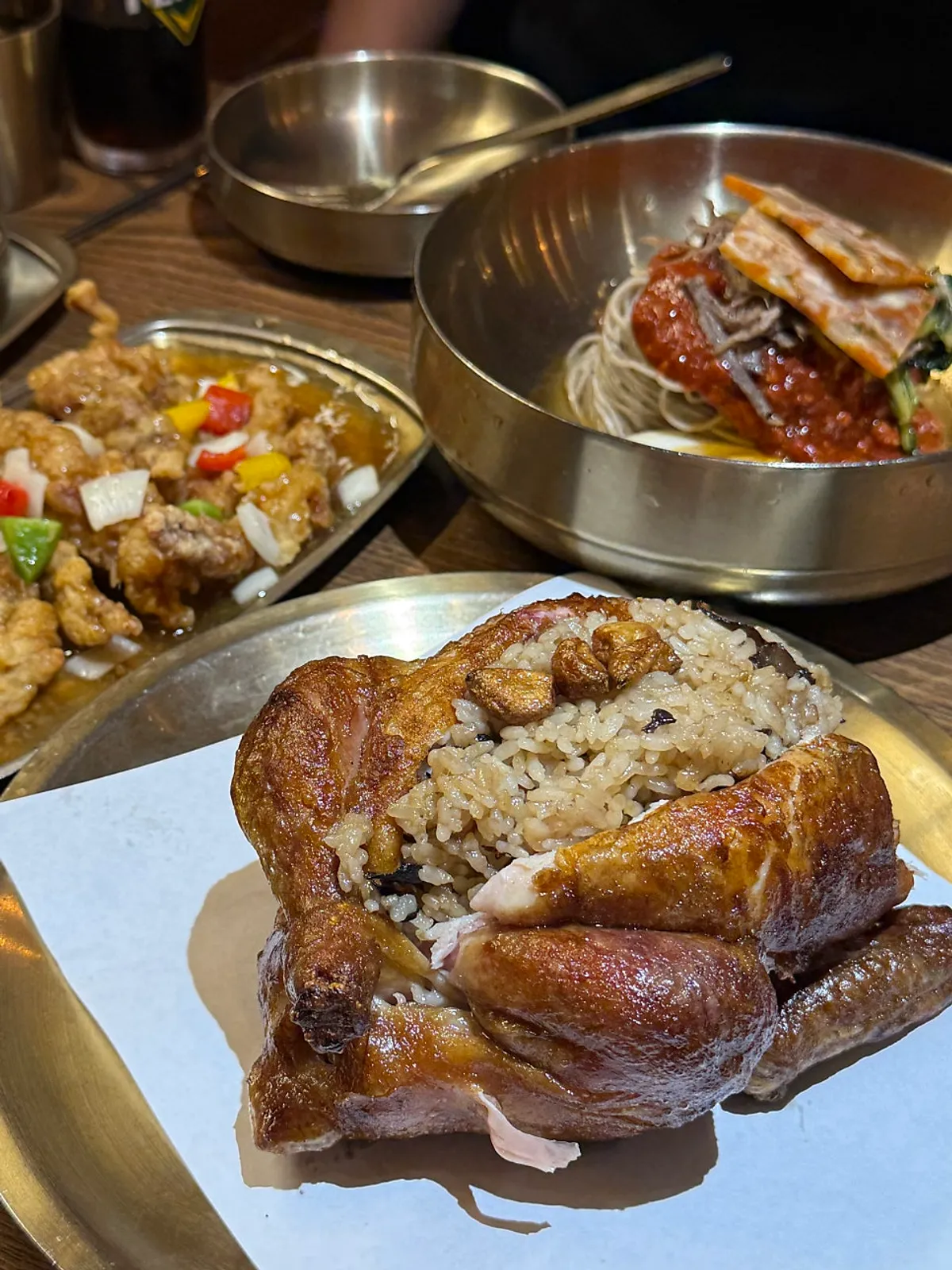 A full spread of Gyeryugwan's oak-fired chicken with neungi mushroom
