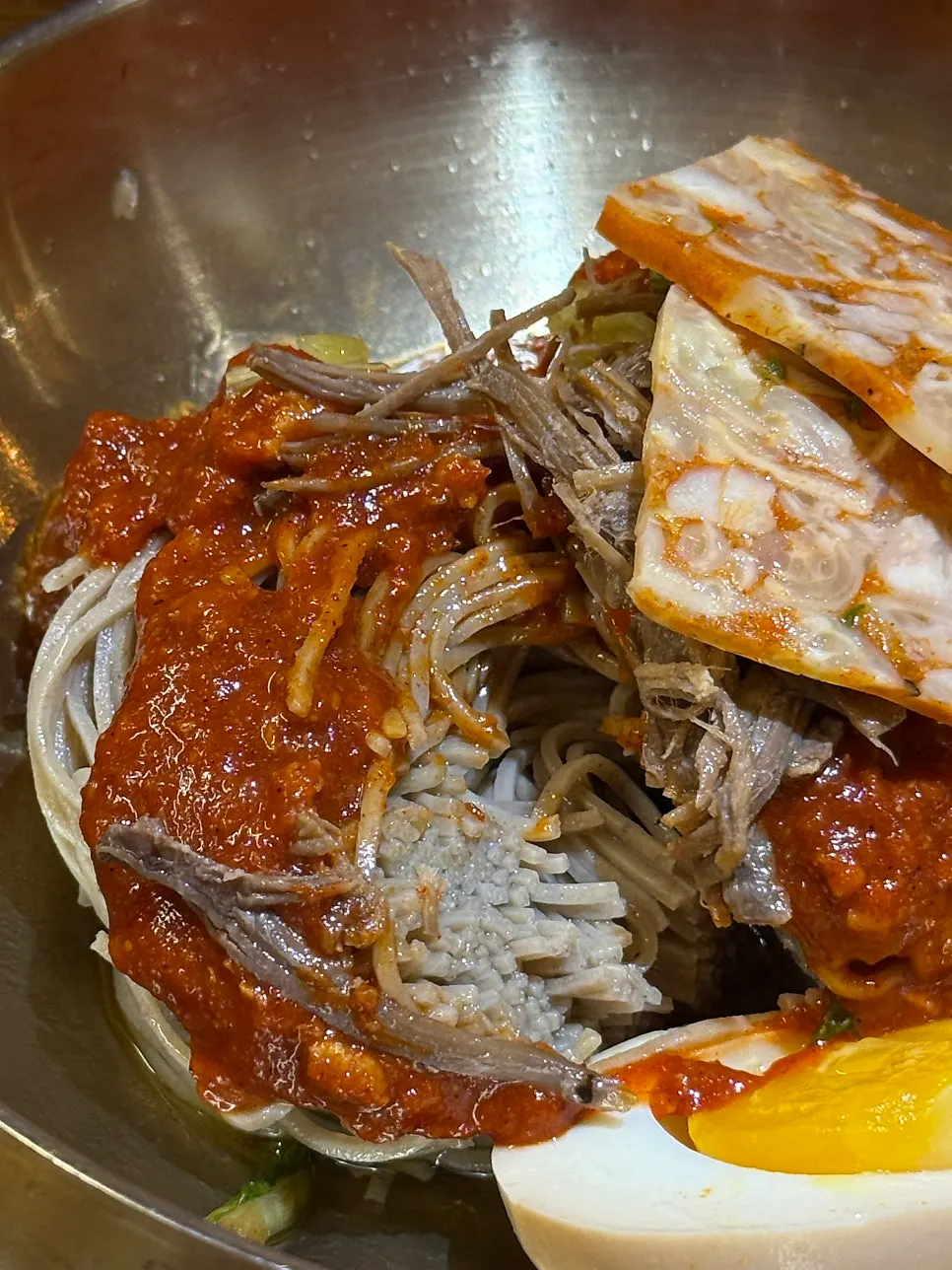 Table with oak-fired chicken and makguksu