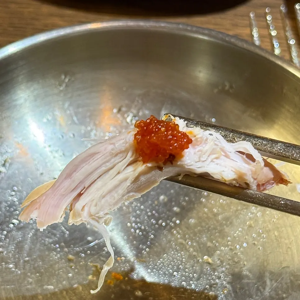 Oak-fired chicken split in half showing the inside
