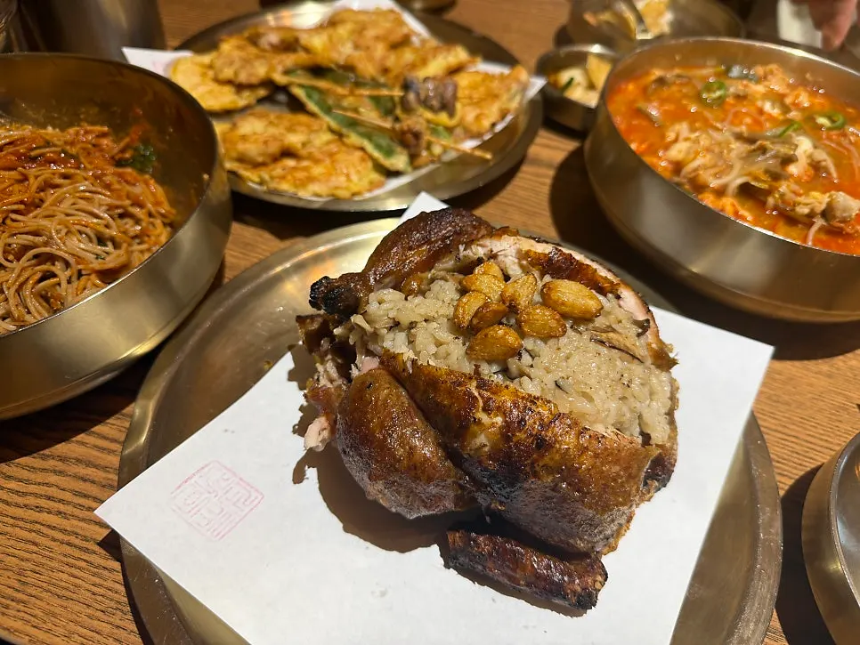 A whole oak-fired chicken with neungi mushrooms at Gyeryugwan