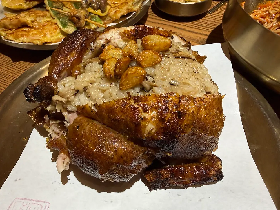 Cross-section of the oak-fired chicken showing the sticky rice inside