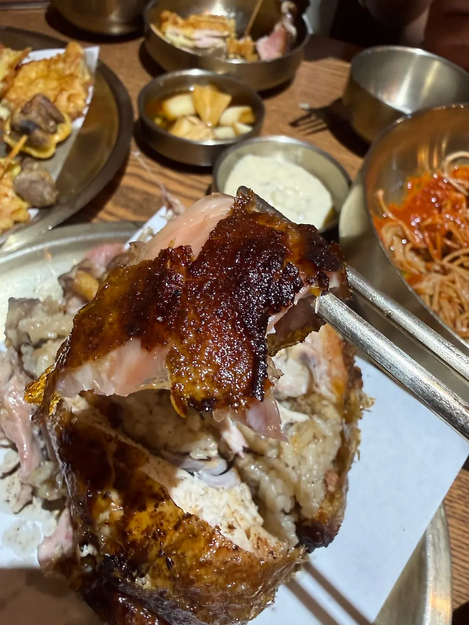Golden, crisply roasted skin of the oak-fired chicken