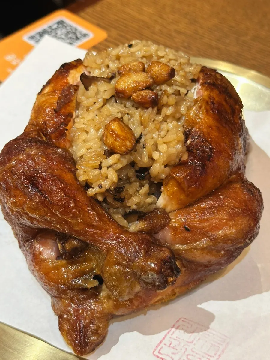 Oak-fired chicken with neungi mushrooms packed with rice