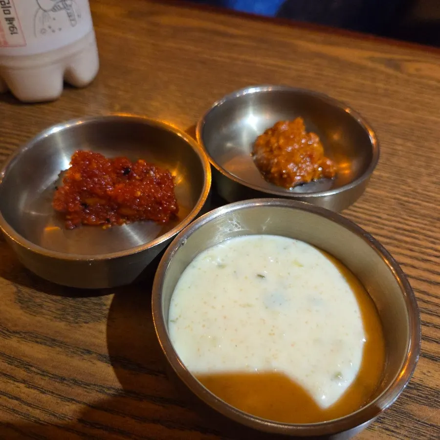 A plate of sauces at Gyeryugwan, including flying fish roe sauce