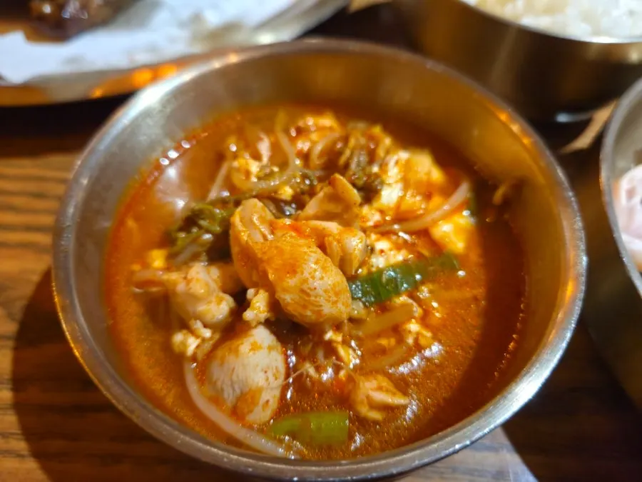 A bowl of Gyeryugwan's dakgaejang packed with ingredients