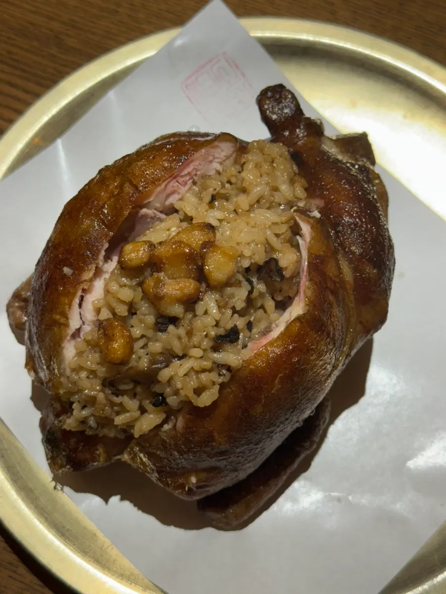 A whole Gyeryugwan oak and neungi mushroom fired chicken