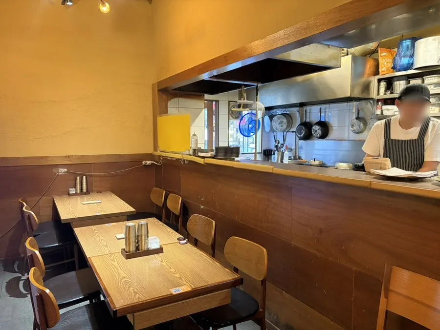 Open kitchen visible from the dining hall