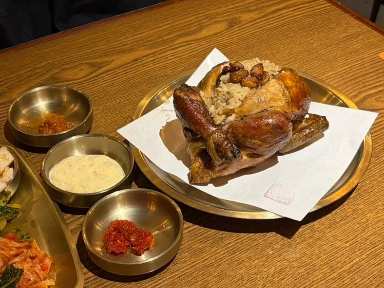 A whole steaming oak-fired mushroom chicken