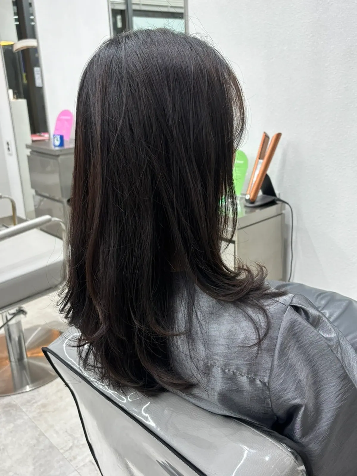 Glossy, neatly styled hair after the clinic treatment