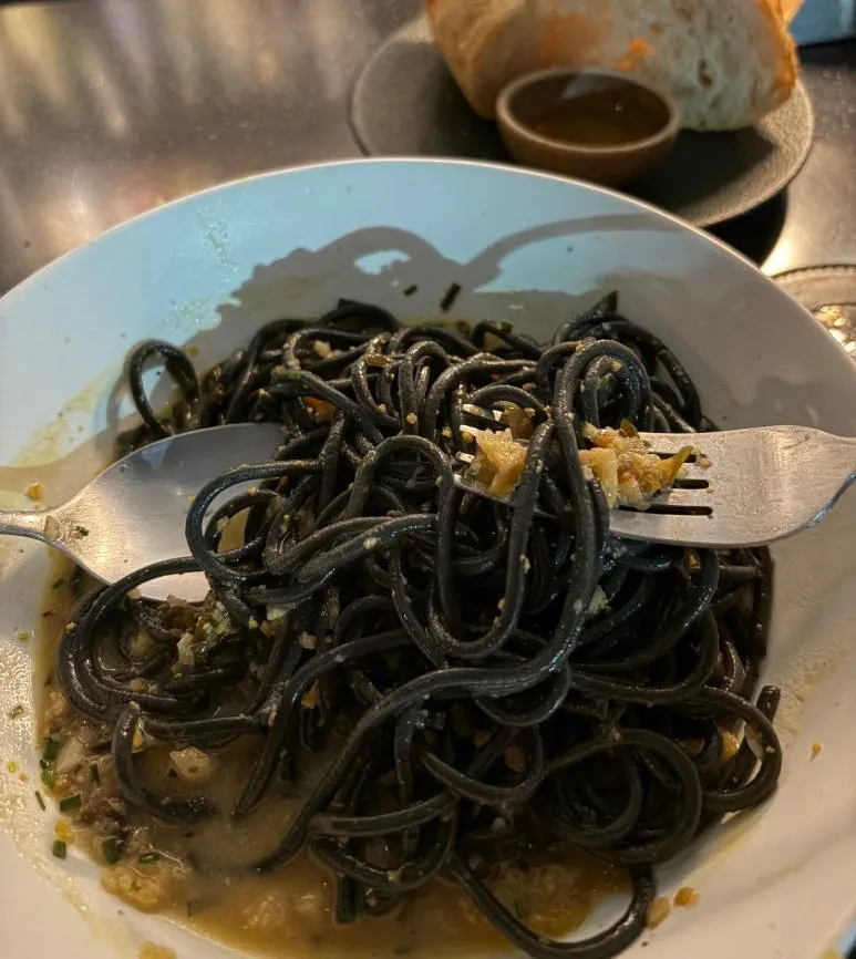 Fresh pasta topped with crispy garnish