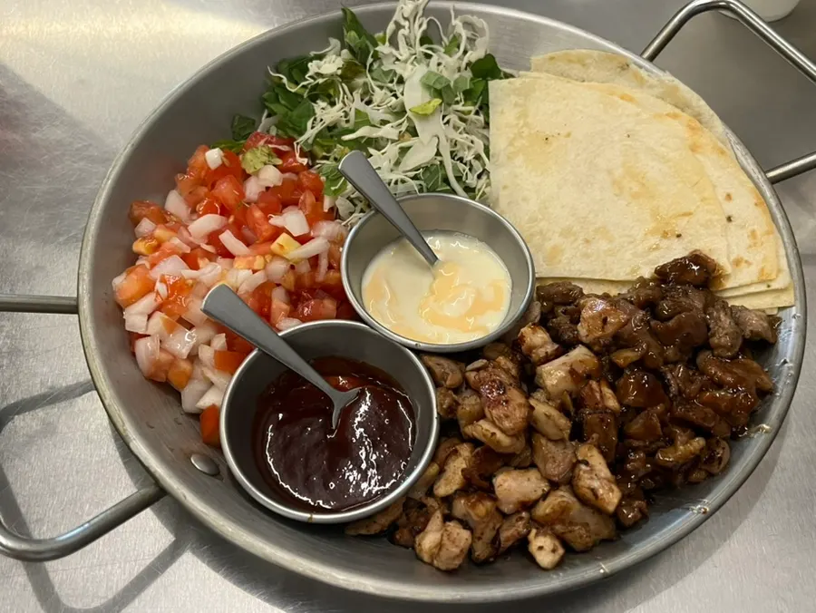Jjeojeoseu's signature beef rib Mexican platter set on the table