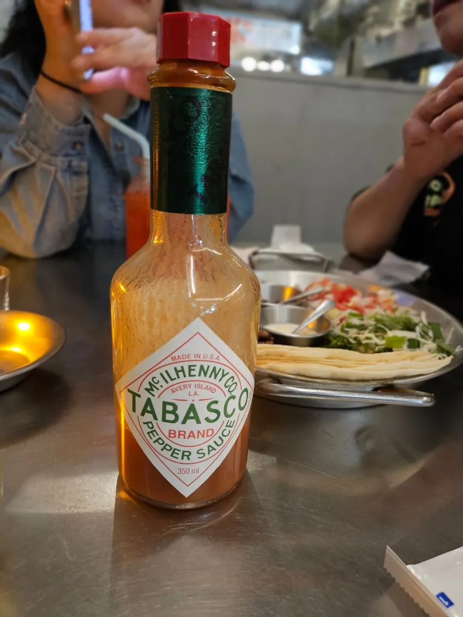 Tabasco sauce placed on the table