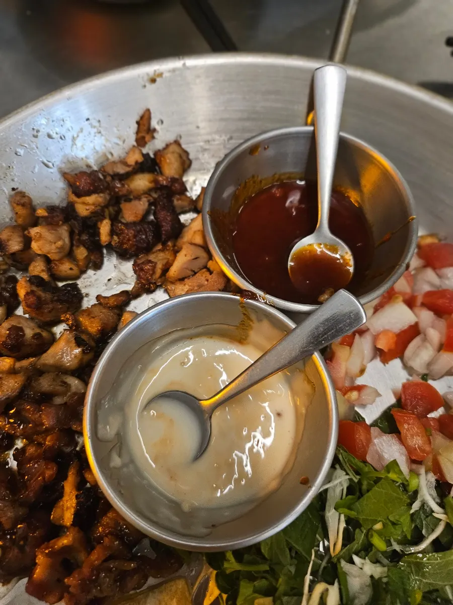 A taco loaded with plenty of sauce