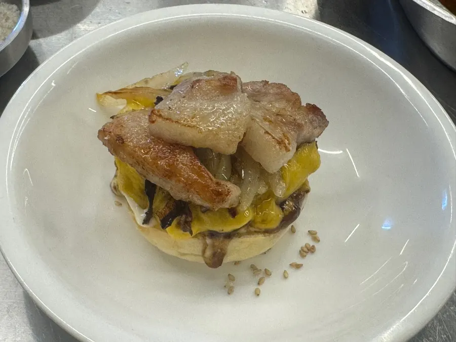 Beef-and-pork hamburger topped with pork belly