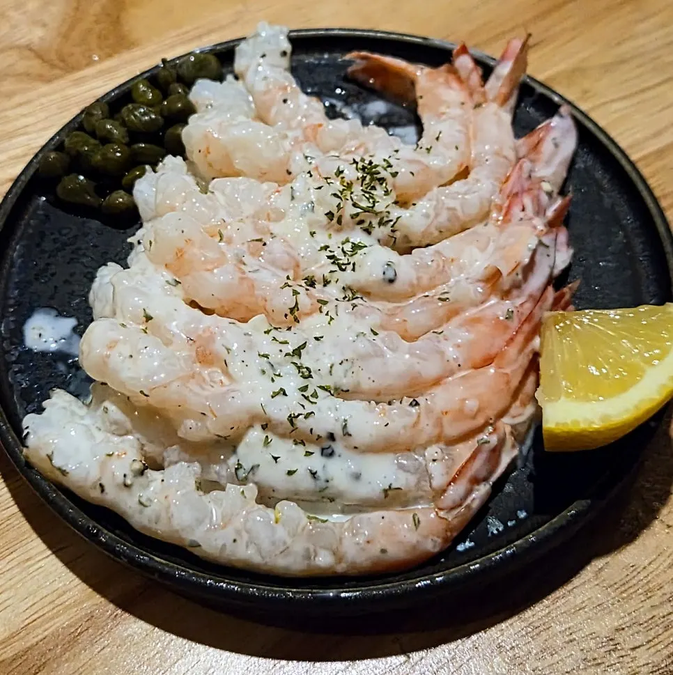 Table setting with yogurt lemon shrimp and oden