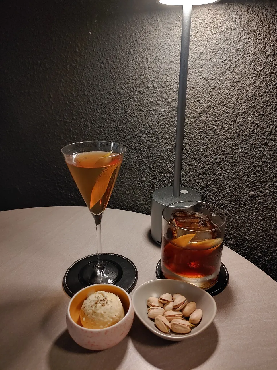 Two cocktails and an ice cream on the table
