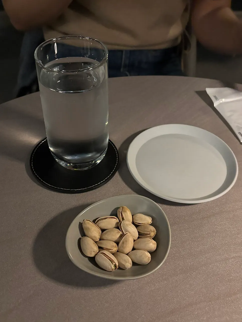 Wet towel and water set on the table at Plot