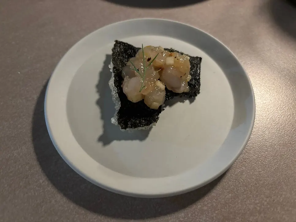 Sweet shrimp and dill on top of gim-bugak