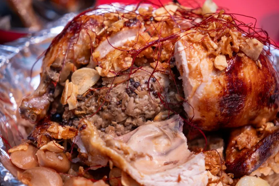 Golden chicken showing the mushrooms stuffed inside