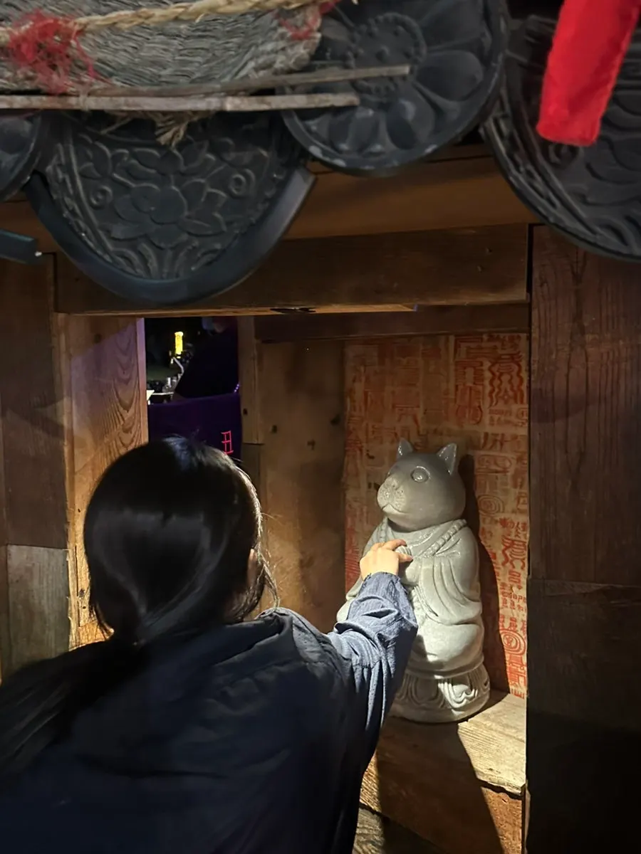 A tiny door that looks like an entrance to a secret space