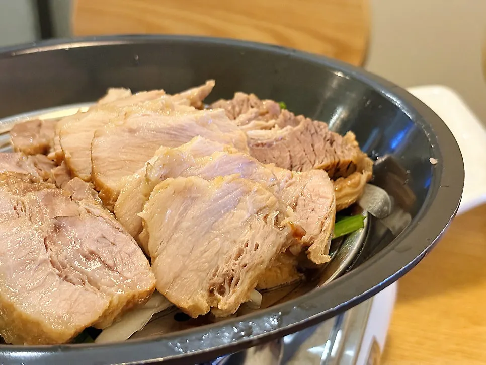 Bossam pork and kimchi wrapped in lettuce