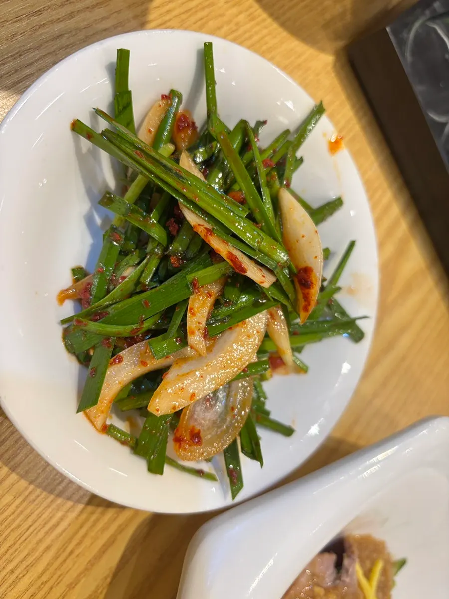 Assorted wraps and kimchi side dishes