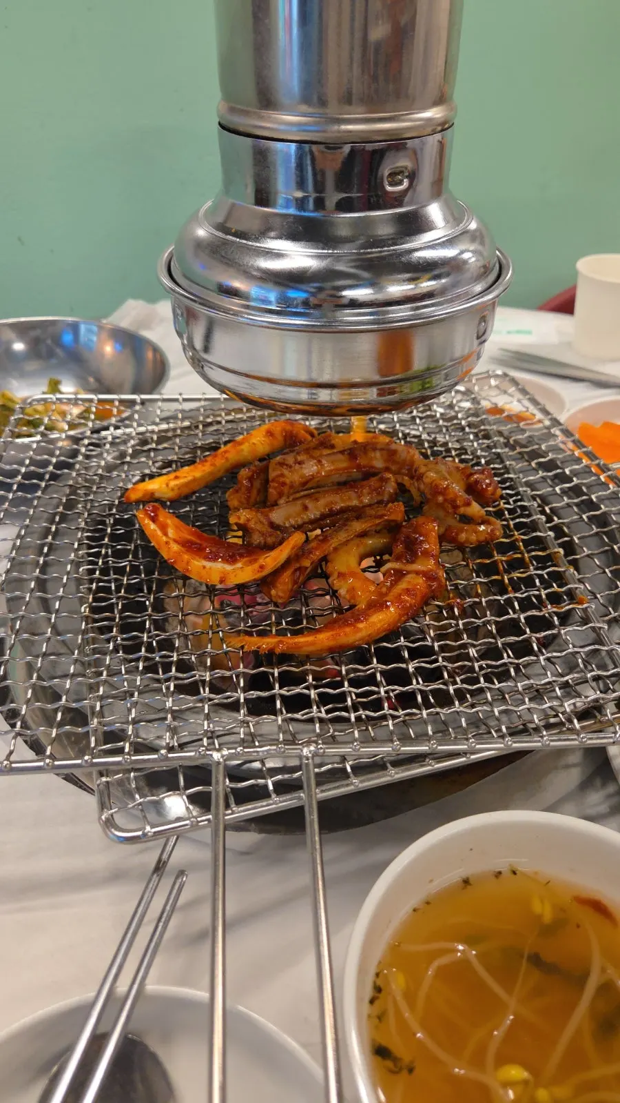 Seasoned hagfish and octopus on the charcoal grill