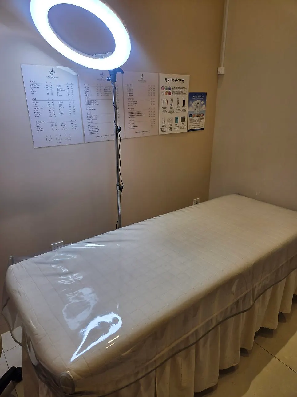 1:1 eyebrow consultation being done with a hand mirror