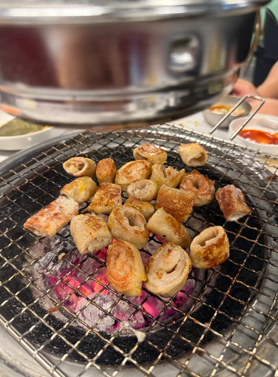 A table setting with kkomjju and yeolmu mulguksu