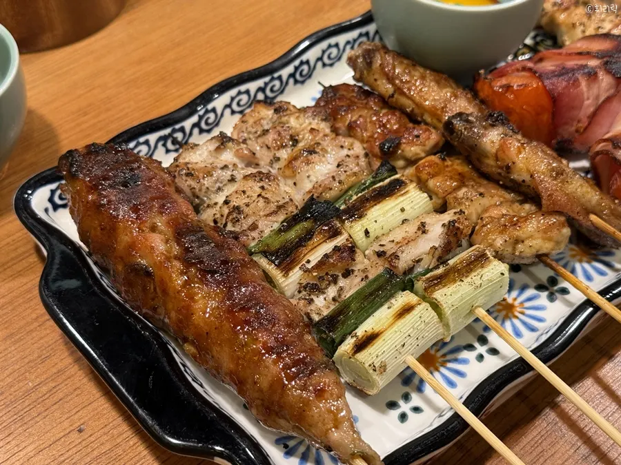 Close-up of a yakitori skewer full of charcoal aroma
