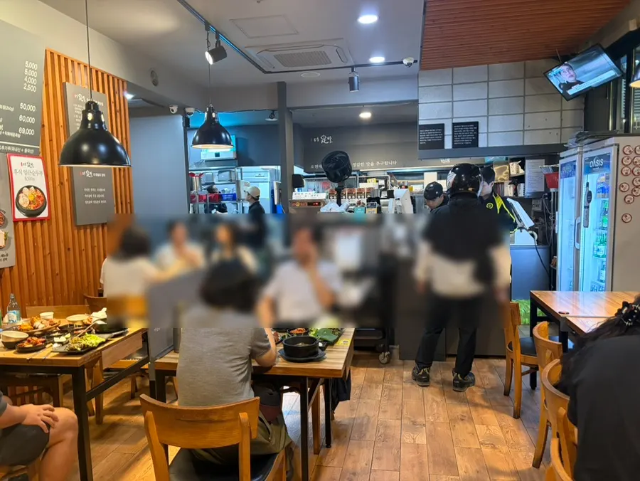 Interior of The Jokbal Sindorim Main Branch with early-evening customers