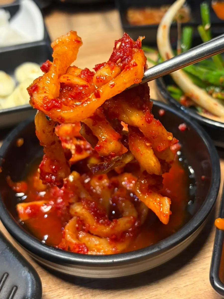 Spicy and regular jokbal enjoyed with soju
