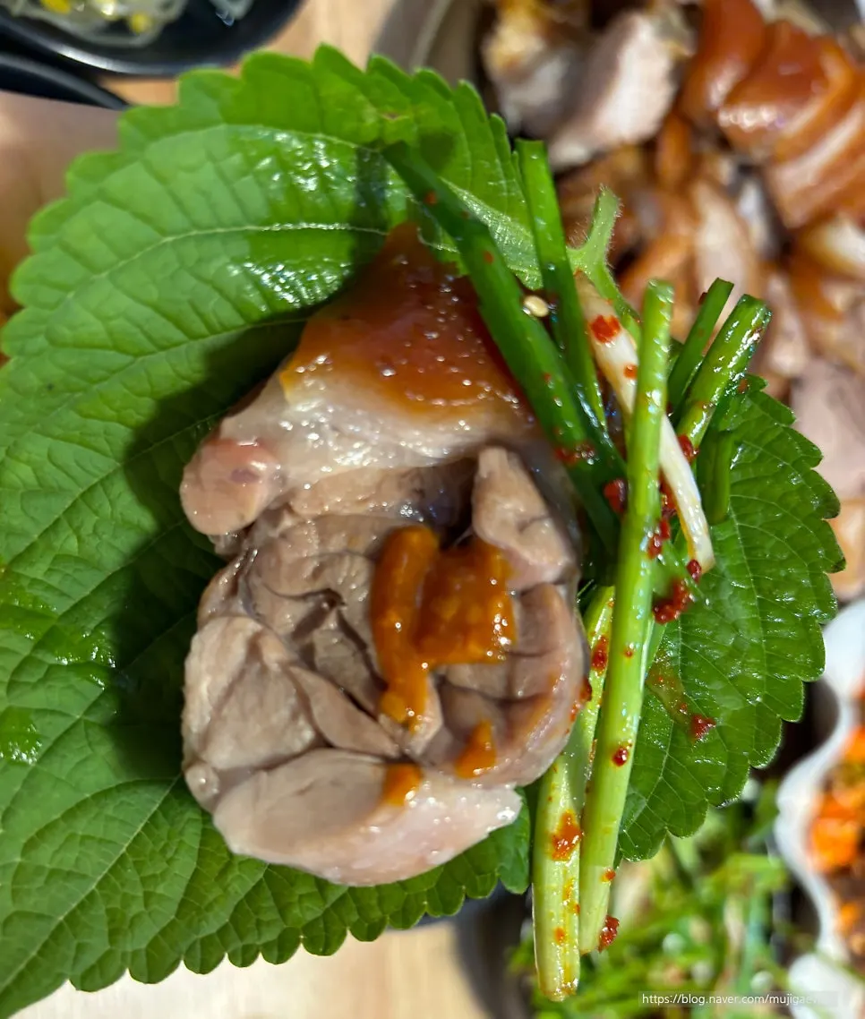 A piece of jokbal topped with dried radish strips