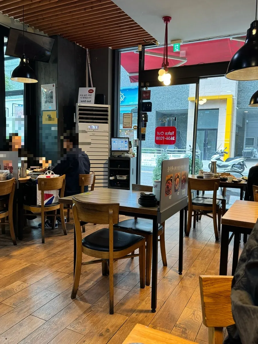 Interior of The Jokbal Sindorim Main Branch with table seating