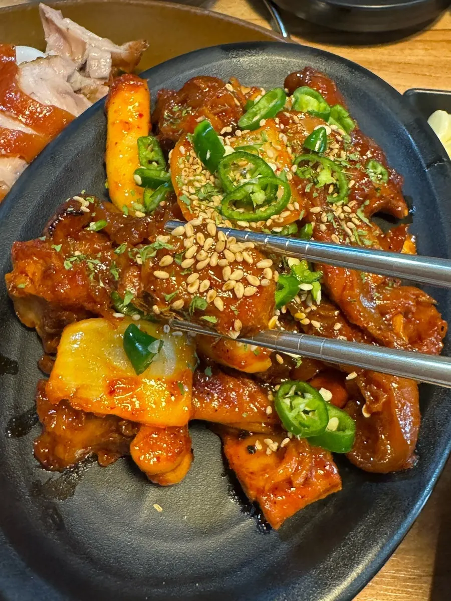Spicy jokbal coated in a spicy sauce