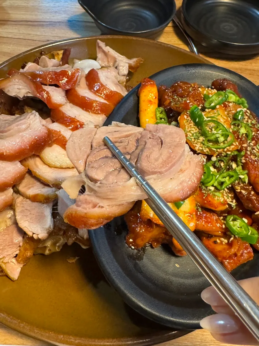 A piece of jokbal placed on a wrap vegetable