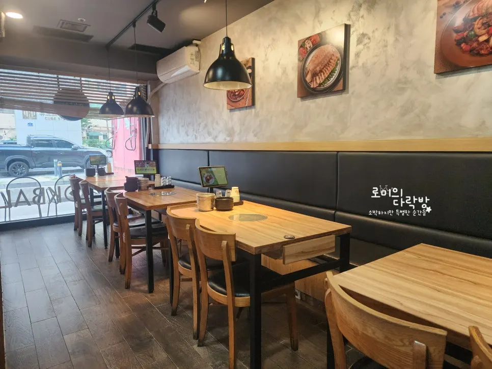 Restaurant interior with floor-to-ceiling windows and tables