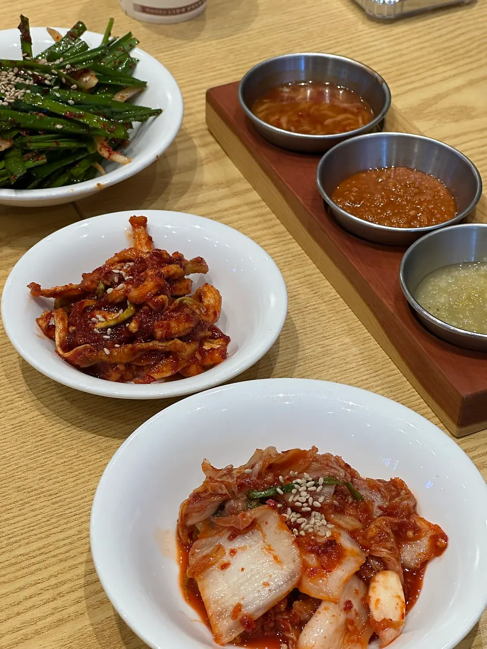 Basic side dishes of chive salad, dried radish strips, and kimchi