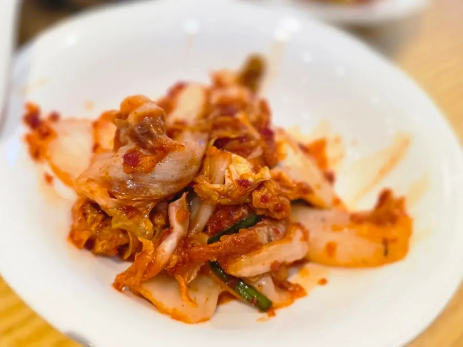 Tasting portion of cold jokbal salad served as an extra