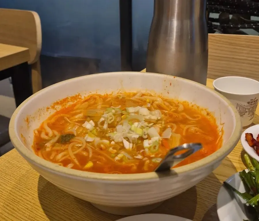 Spicy kalguksu upgraded for an extra ₩1,000