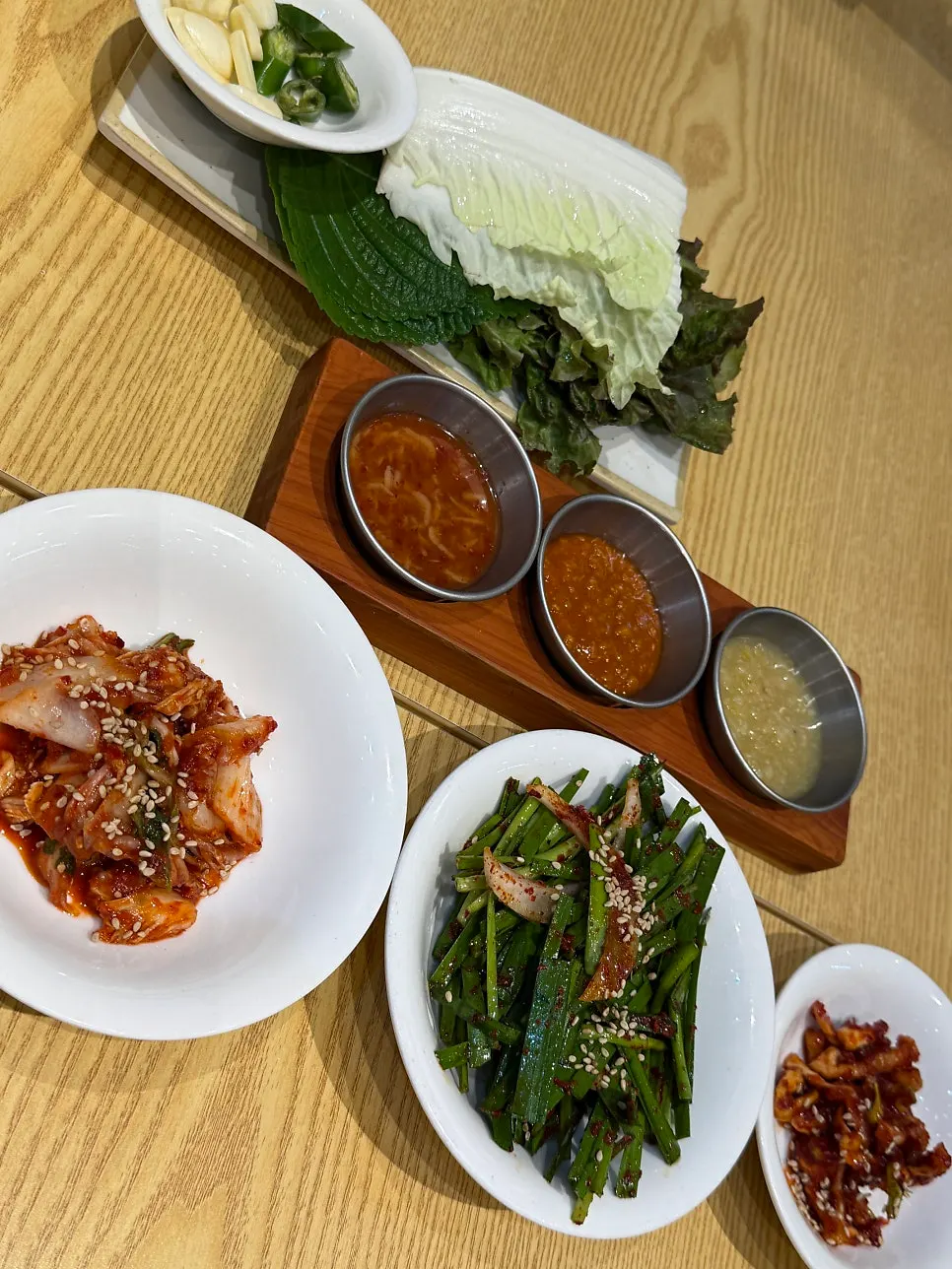 Table with bossam and kalguksu served together