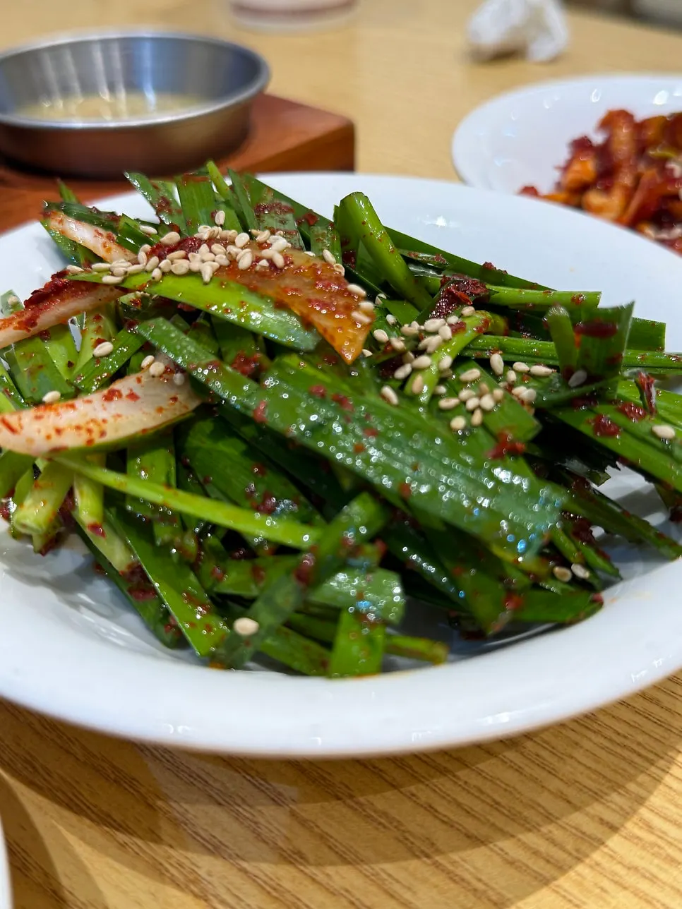Basic side dishes of chive salad, geotjeori, and radish kimchi