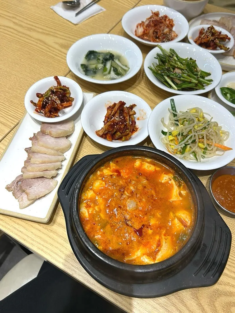 Plate of sweet-and-tangy yeolmu kimchi and other side dishes