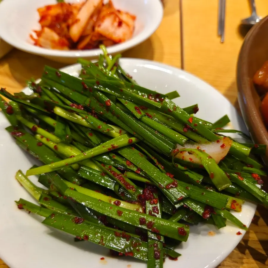 A plate of Sambaekga's basic kimchi side dish